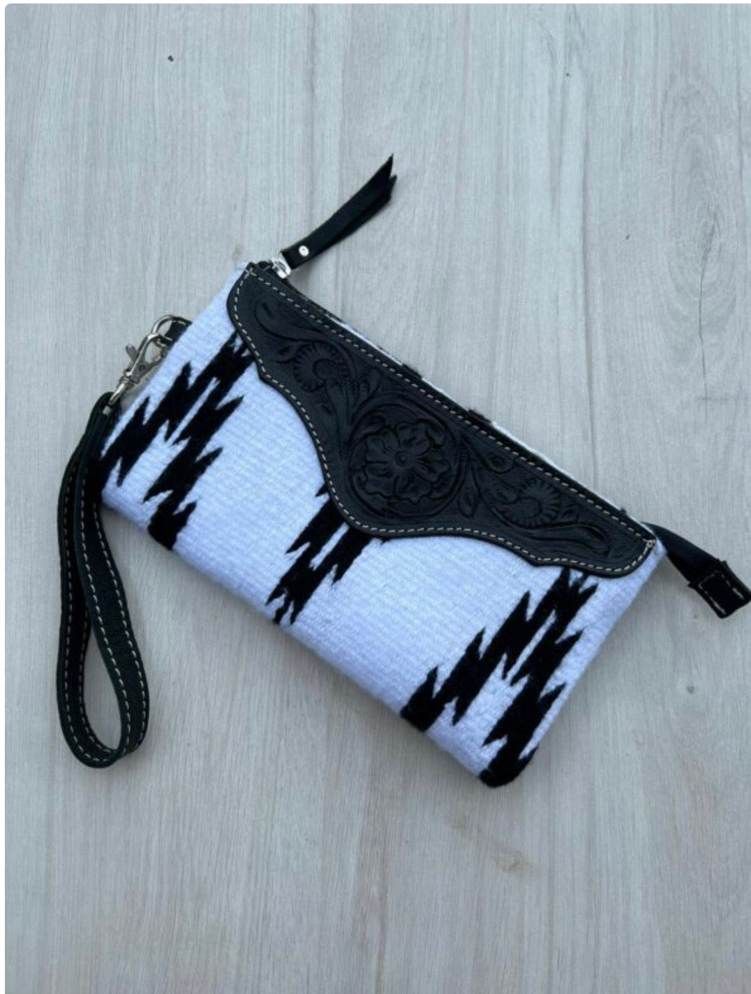 B/w saddle blanket clutch with tooled leather