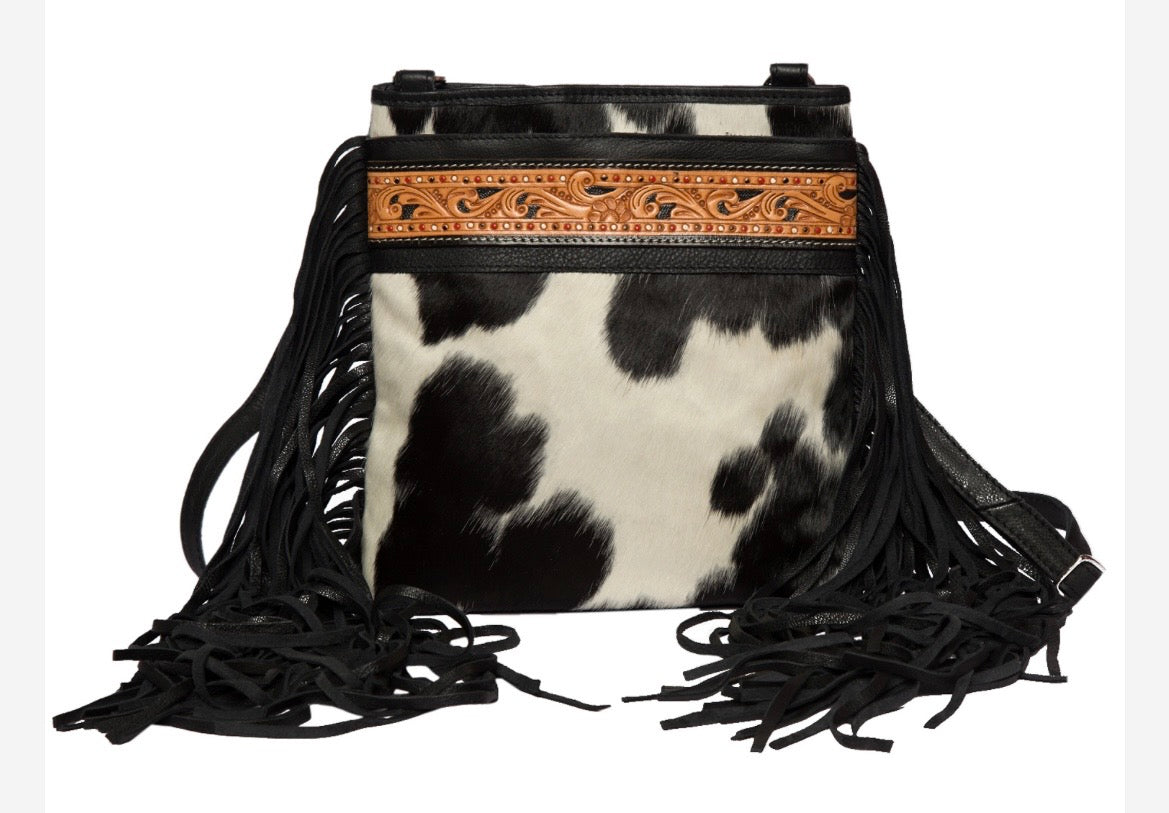 Hand painted cowhide with fringe.